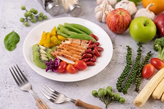 Colourful healthy plate filled with fresh, nutritious foods for a balanced diet